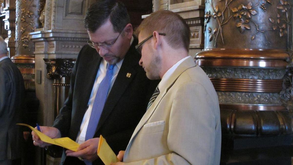 Kansas Senate Majority Leader Terry Bruce, left, R-Nickerson, confers with Peter Northcott, his chief of staff, about the chamber’s schedule as it debated numerous bills on Monday. (Feb. 22, 2016)