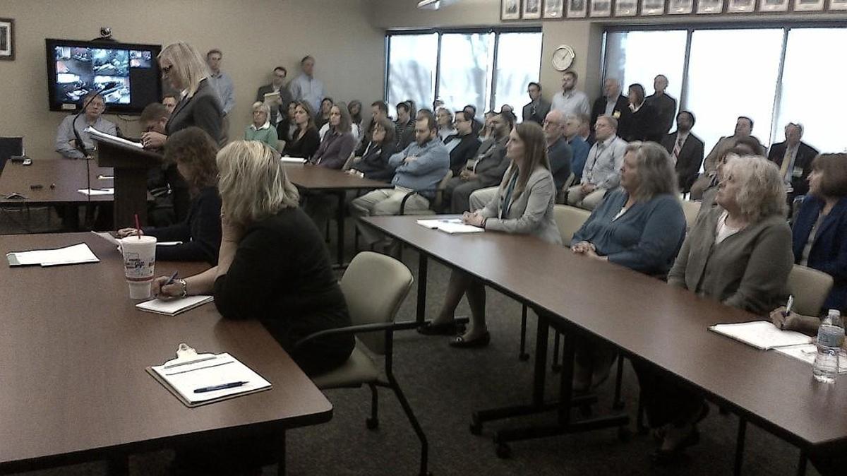 Kansas Corporation Commission employees pack the commission’s hearing room Thursday for an annual report on the operation of the agency. More than nine out of 10 of the KCC’s civil-service employees gave up their job protection for a 7.5 percent pay raise last year.
