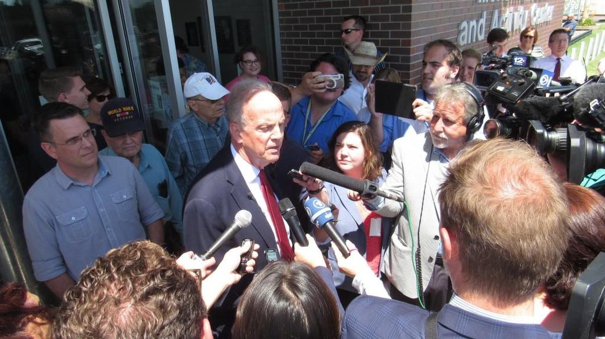 Sen. Jerry Moran answers reporters’ questions at a town hall meeting this summer