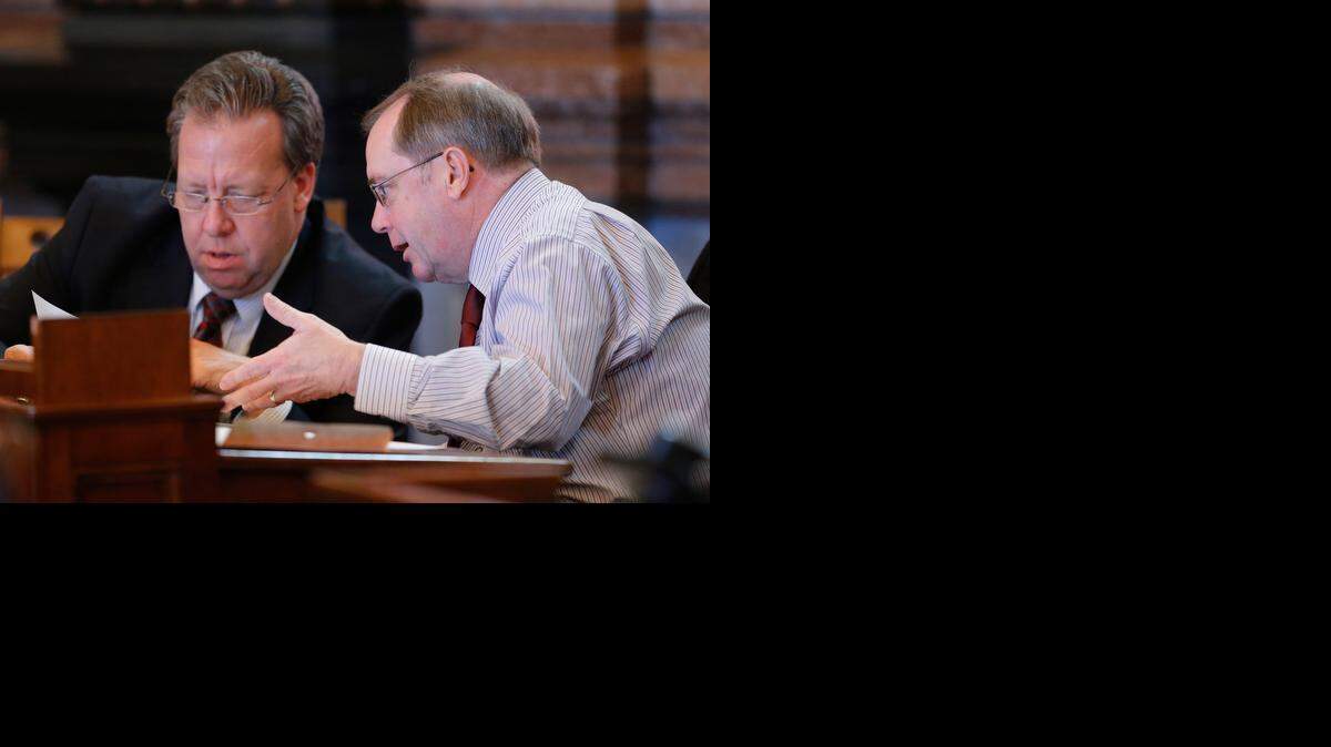
Sen. Tom Holland, left, shown with Sen. Anthony Hensley, asked for a federal analysis of a Senate bill changing employee policies. (Jan. 16, 2013)
