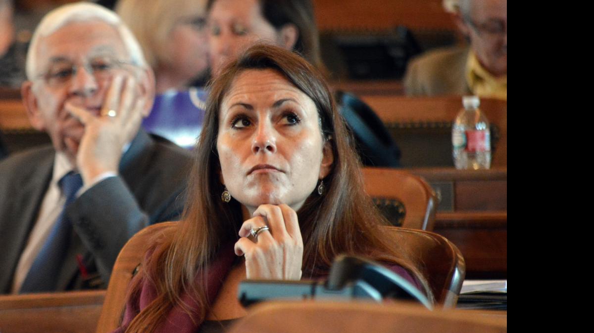 
Kansas state Rep. Kasha Kelley, R-Arkansas City, watches one of the House's electronic tally boards as members vote for a budget Wednesday, June 3, 2015, at the Statehouse in Topeka. 

