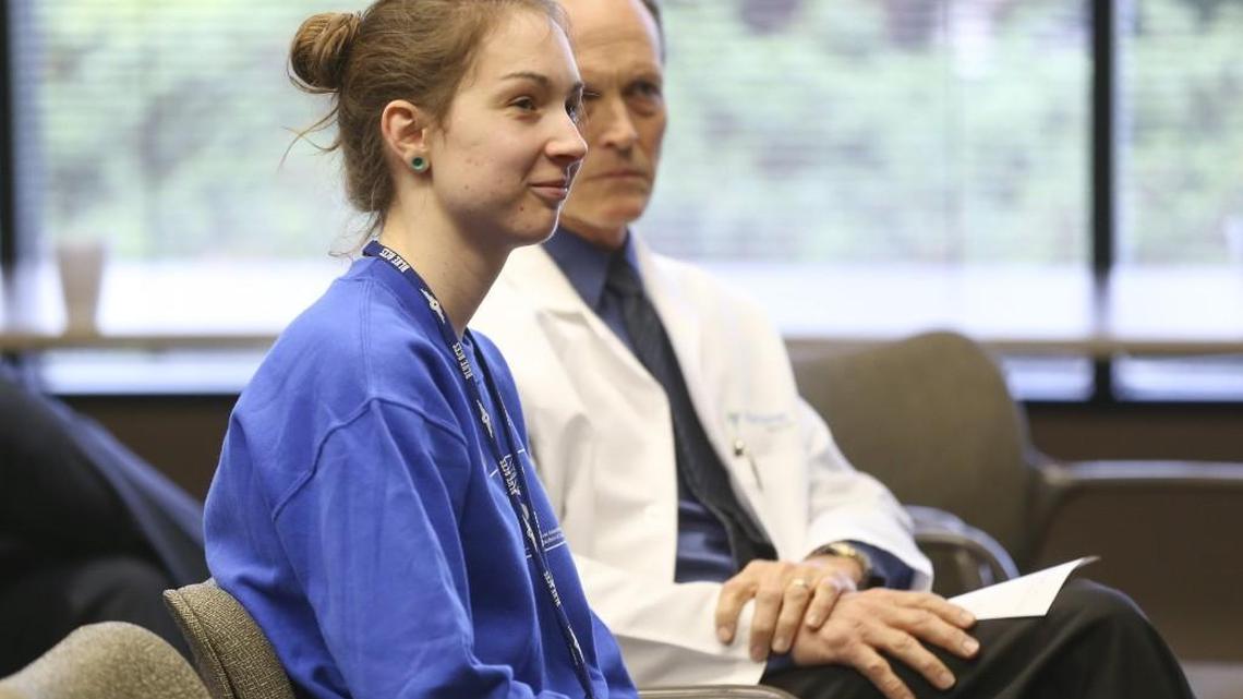 Marcillene Dover listens to a forum about Medicaid expansion on Wednesday. Dover is a full-time education major at Wichita State University, has multiple sclerosis and would receive insurance coverage through the expansion. (April 20, 2016)