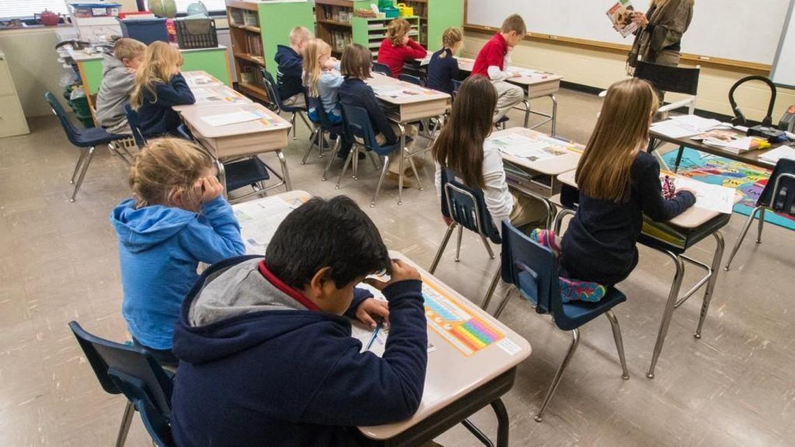 Students work on a daily lesson at McCollom Elementary School. The funding of schools has been a major source of conflict for the Kansas Legislature. (Jan. 7, 2015)