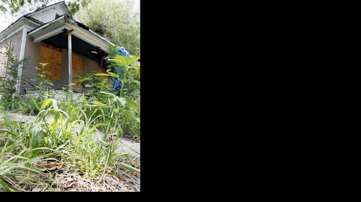 
This condemned house in Wichita had many violations, including being overgrown with grass and weeds.
