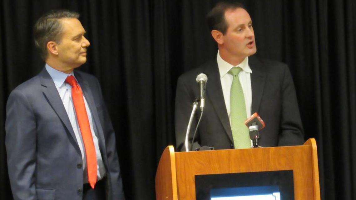 Gov. Jeff Colyer, left, introduces Tracey Mann, right, as his lieutenant governor and running mate on Tuesday night.