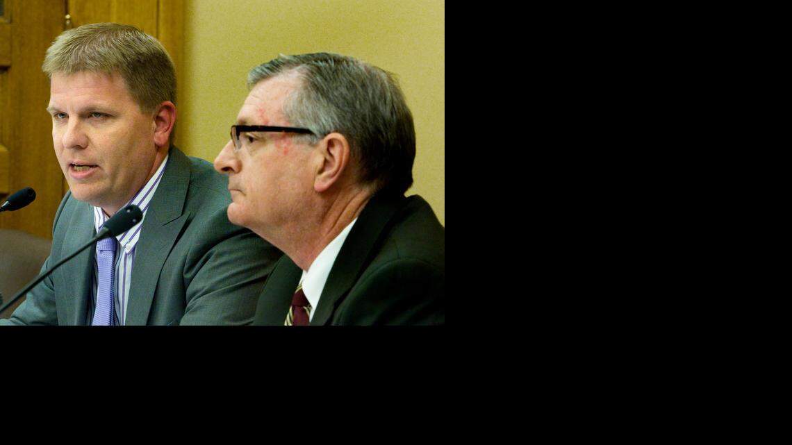 
Shawn Sullivan, left, the governor’s budget director, and Raney Gilliland, director of the Kansas Legislative Research Department, present the Consensus Estimating Groups State General Fund Revenue Estimate during a news conference Monday at the Statehouse in Topeka. (Nov. 10, 2014) 
