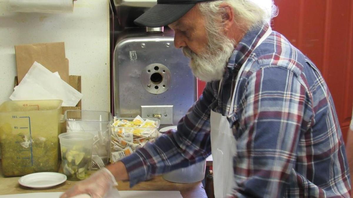 Charlie Porubsky Jr., the son of the deli’s founder, makes a hoagie for a customer.