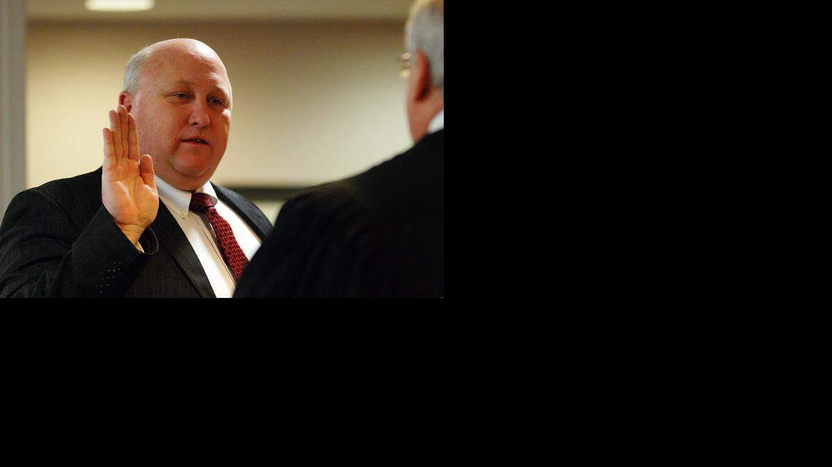 
Richard Ranzau is sworn in for a new term on the Sedgwick County Commission on Sunday afternoon. (Jan. 11, 2015)

