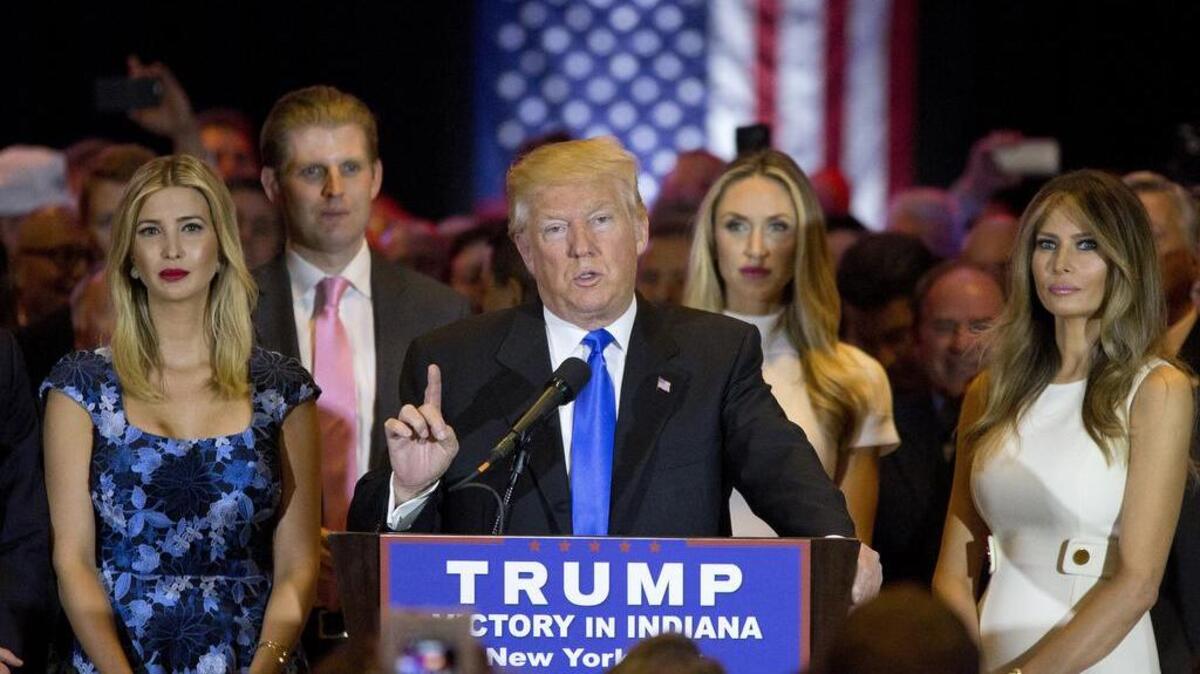 Republican presidential candidate Donald Trump is joined by his wife, Melania, right, daughter Ivanka, left, and son Eric, background left, during a news conference last week in New York. Trump is trying to reshape his image from Manhattan playboy to presidential family man.
