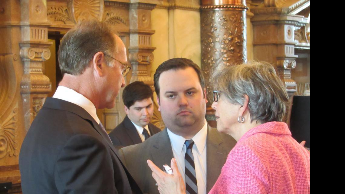 
Senate President Susan Wagle, R-Wichita, confers with Sen. Jeff Longbine, left, R-Emporia, and an aide during Wednesday’s tax debate. 
