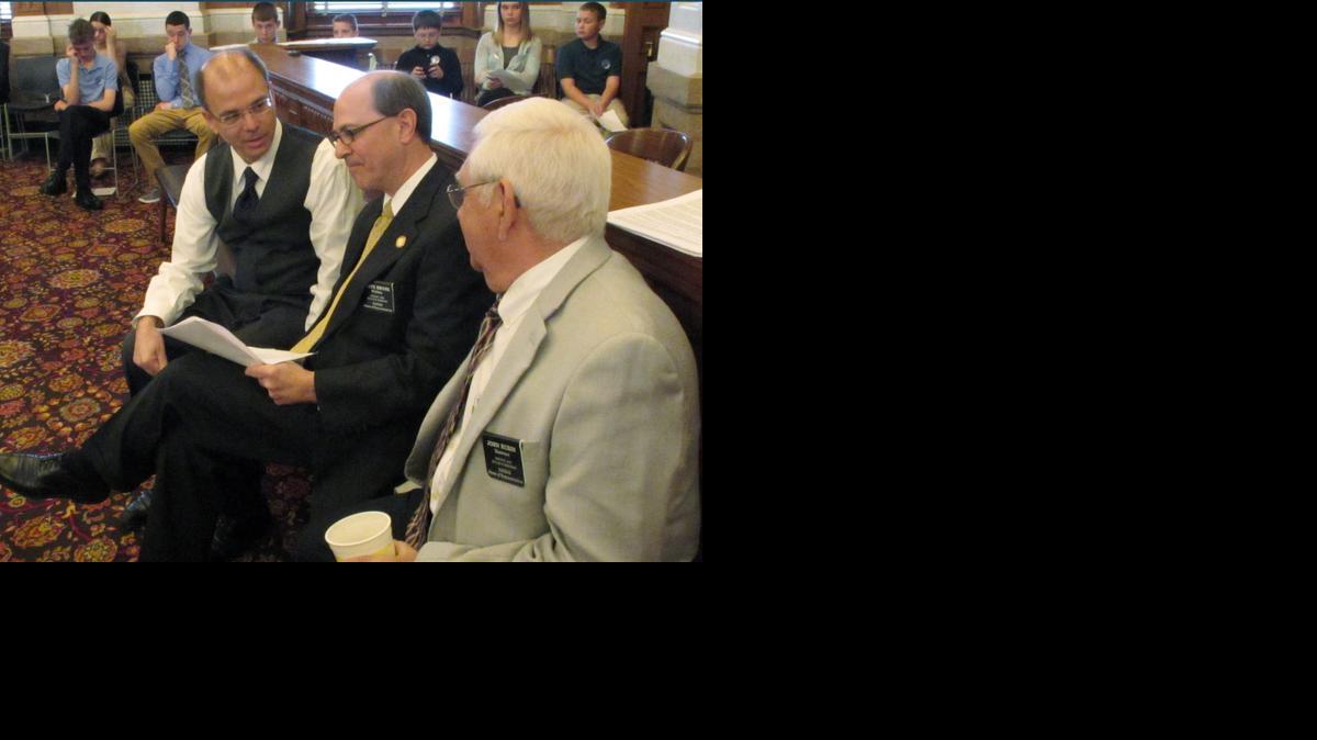 Kansas House members, from left, Mark Kahrs of Wichita, Steve Brunk of Wichita and John Rubin of Shawnee confer Wednesday during the chamber’s debate on anti-abortion legislation at the Statehouse in Topeka. The three Republicans support the bill, which bans a procedure described by abortion opponents as "dismembering" a fetus. 
