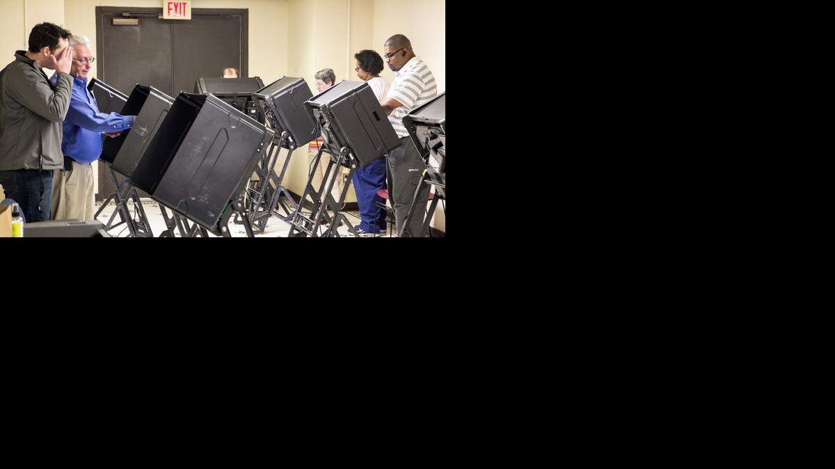 
Voters take advantage of advance voting at the election office in the old Sedgwick County courthouse in October. Voting machines in Sedgwick County and across the country are starting to wear out, prompting conversations about how they will be replaced.
