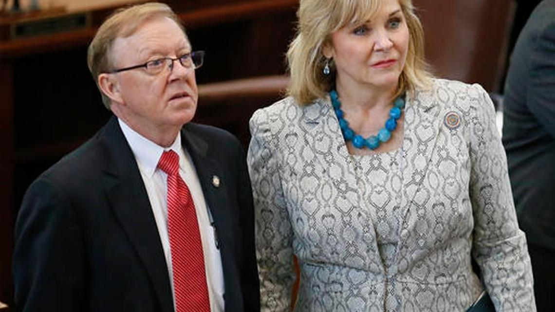 Oklahoma state Rep. Earl Sears, R-Bartlesville, left, and Oklahoma Gov. Mary Fallin, right, on the floor of the House in Oklahoma City on Wednesday.