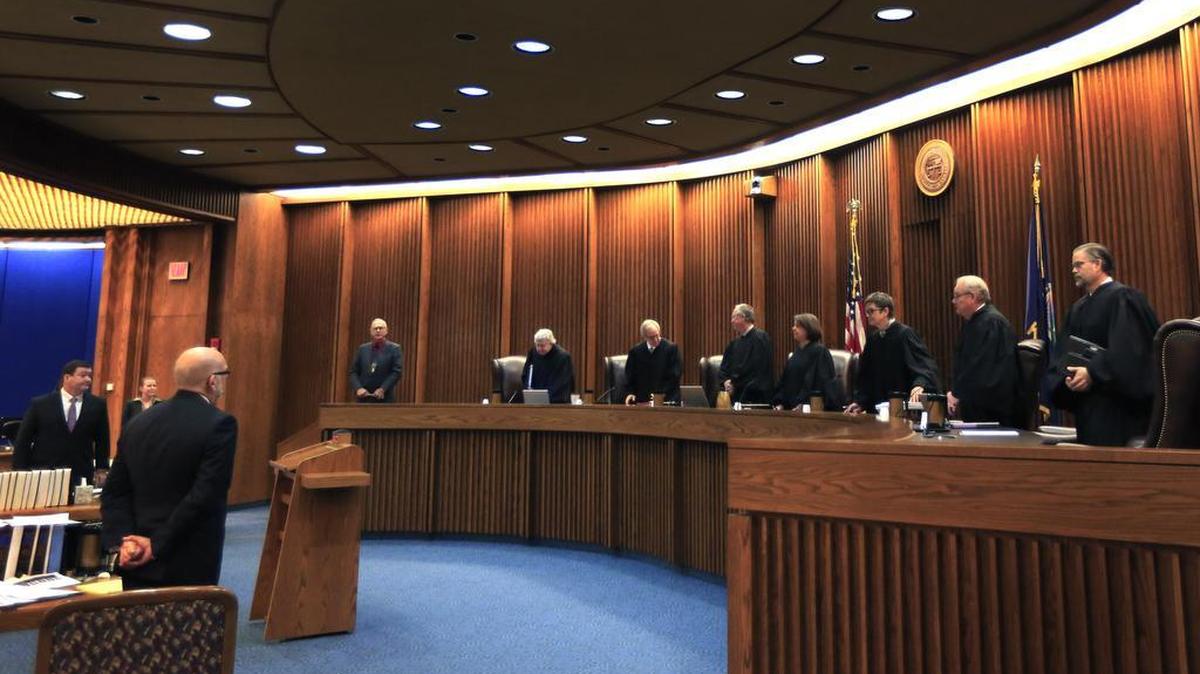 Kansas Supreme Court justices prepare to hear oral arguments in a case last year.