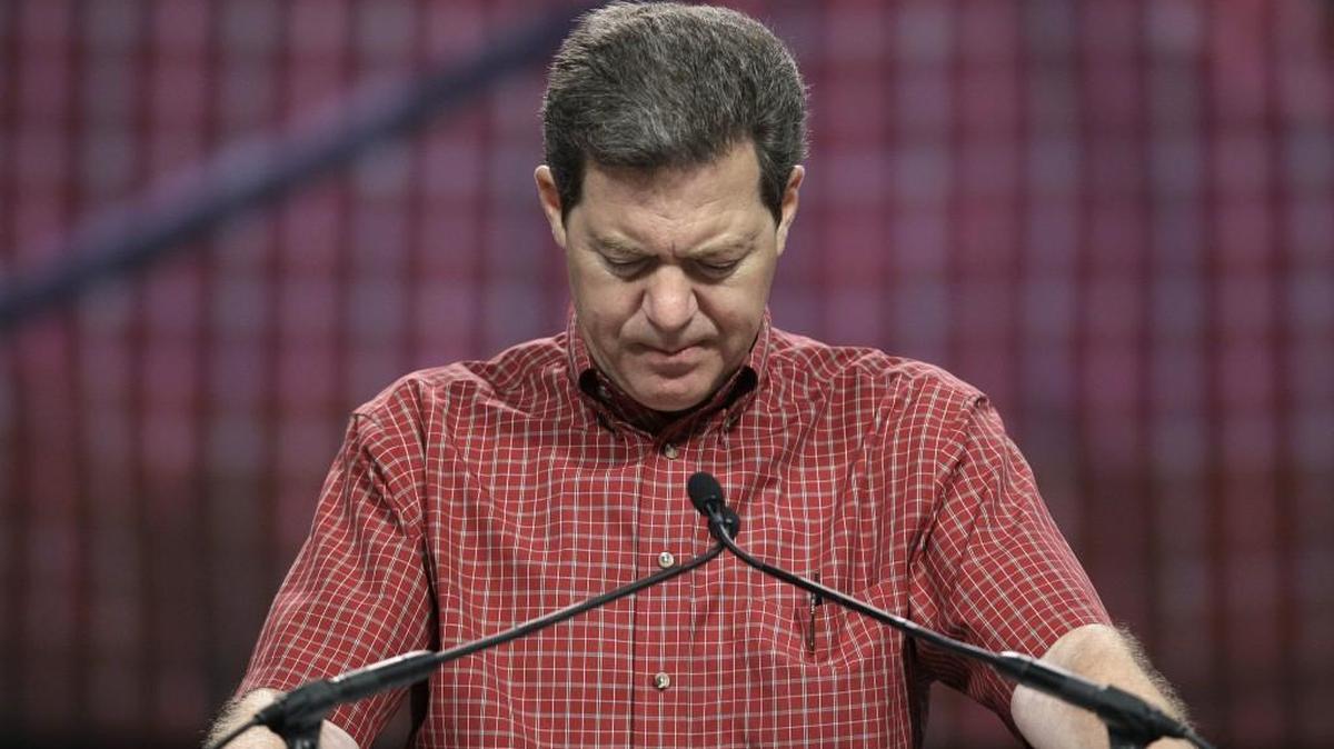 Kansas Gov. Sam Brownback prays in 2011. His final proclamation as governor invites Kansans to pray and fast on his last full day in office Wednesday, Jan. 31, 2018.