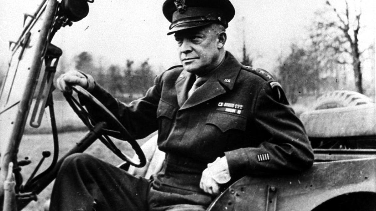 General Dwight Eisenhower, Supreme Allied Commander, sits at the wheel of his jeep somewhere in France, as he prepares to drive to meet representatives of each Allied country to deliver his Christmas message to all Allied forces, Dec. 28, 1944.  (AP Photo)