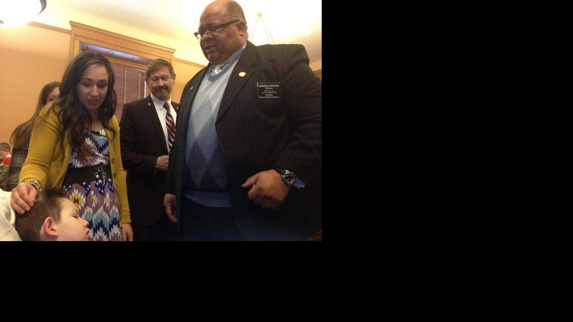 
Rep. Roderick Houston, D-Wichita, right, checks on Kiley Klug and her son, Owen, after a hearing in Topeka on hemp oil at which her son had seizures.
