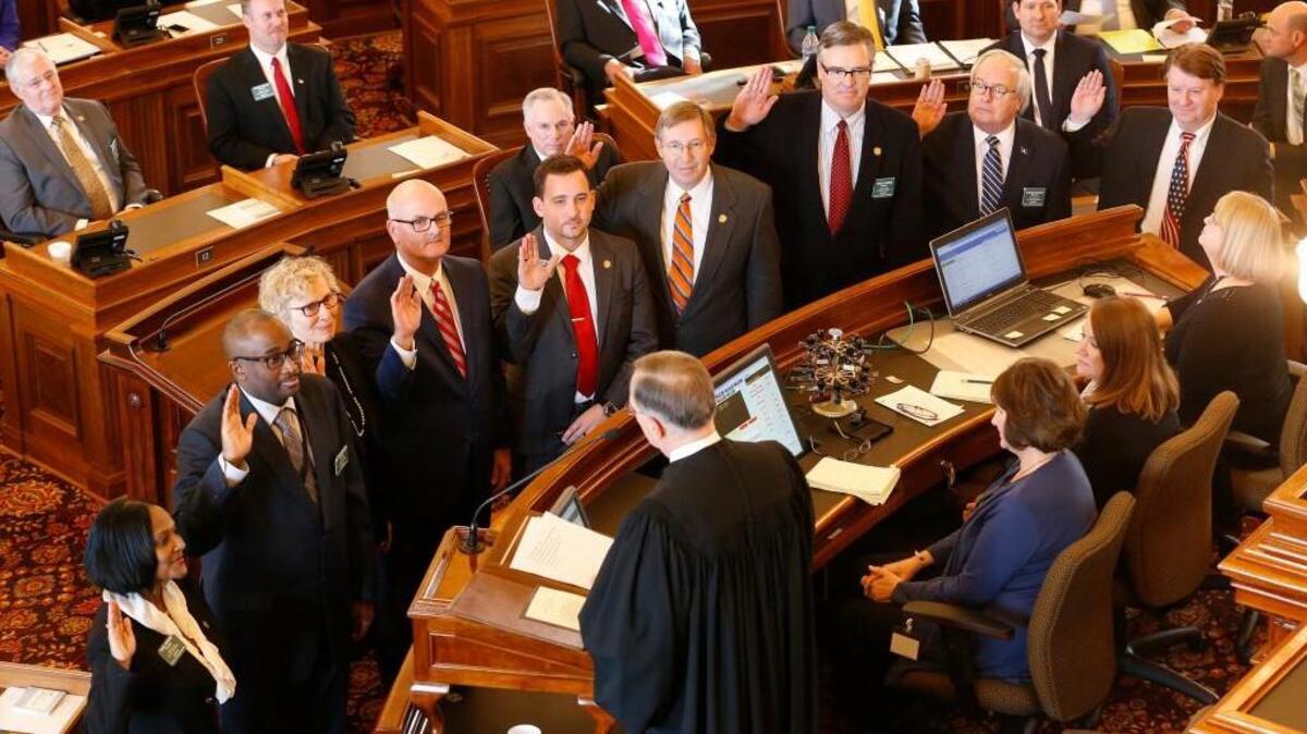 Kansas Supreme Court Justice Lawton Nuss swears in members of the Kansas House of Representatives, including a number of representatives from Wichita, on Monday afternoon as the 2017 Legislature convenes. (Jan. 9, 2017)