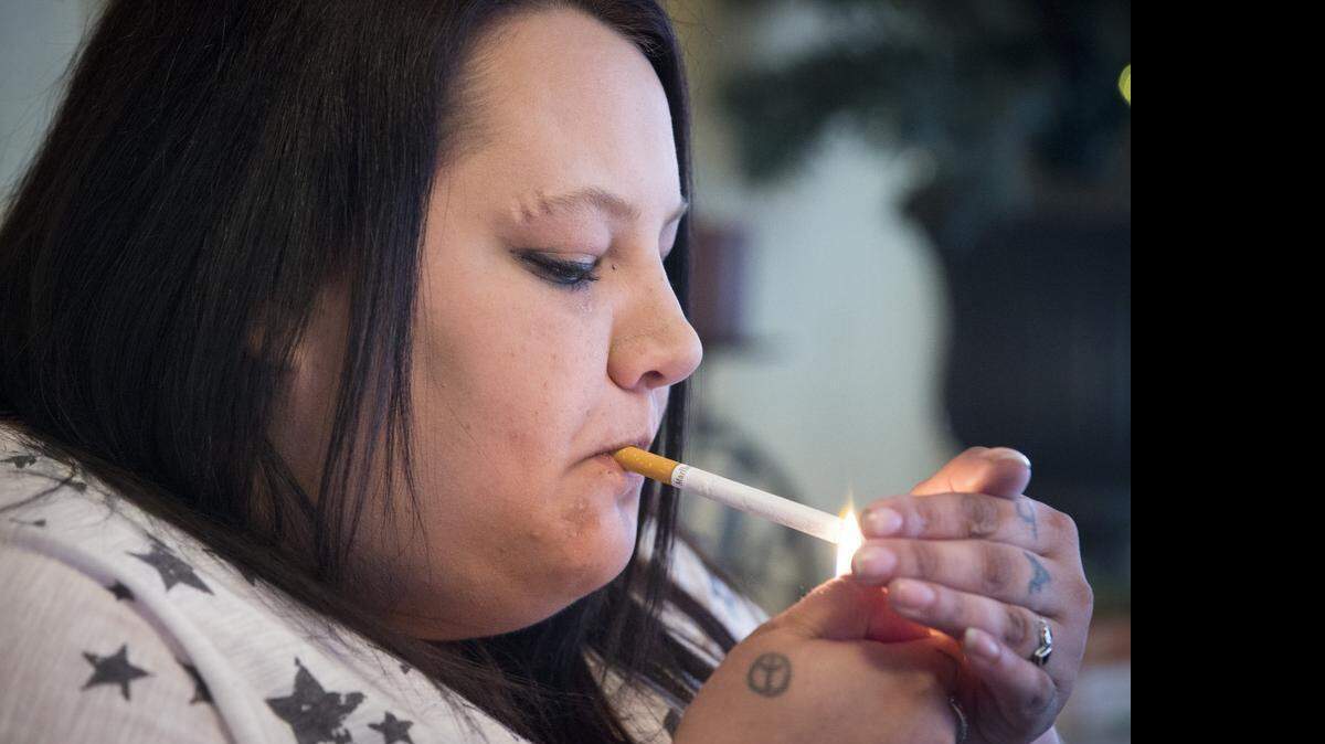 
Lauren Thorp smokes a pack of cigarettes a day to help her cope with a variety of mental health issues. Thorp says she would go to Oklahoma to buy cigarettes if a proposed tax increase on tobacco and alcohol sales passes in the Kansas Legislature. (April 23, 2015)
