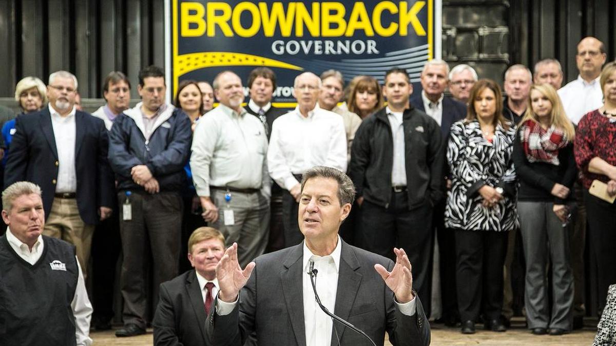 
Gov. Sam Brownback stumps at JR Custom Metal Products Inc. in October. While on the campaign trail, Brownback promised to create 100,000 private-sector jobs over the next four years. (Oct. 10, 2014)
