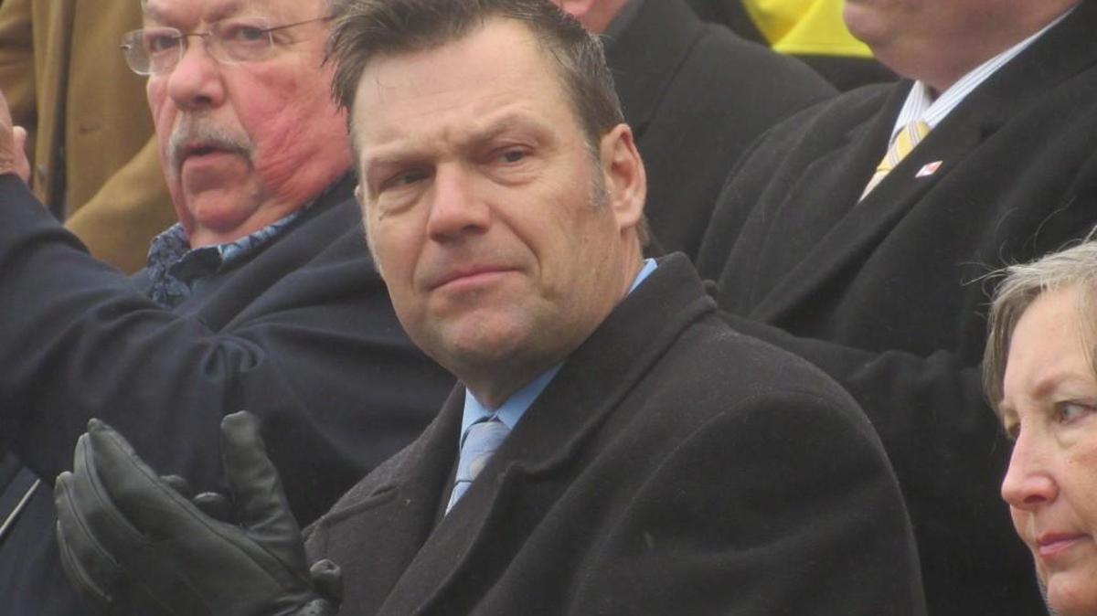 Kansas Secretary of State Kris Kobach stands during an anti-abortion rally on Monday. Kobach is facing criticism over the Crosscheck program, which looks for double voter registrations across the country.