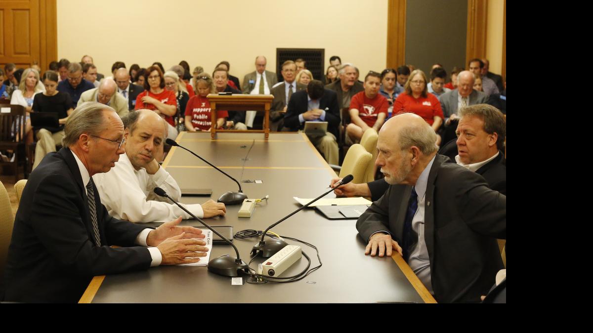 
Kansas House Taxation Committee Chairman Marvin Kleeb, R-Overland Park, left, and Sen. Les Donovan, R-Wichita, right, meet face to face Thursday night as the two hash out the provisions of a new house bill to satisfy the $400 million shortfall in the budget. (June 11, 2015)
