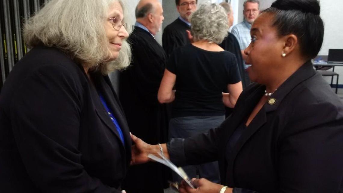 Wichita State University statistician Beth Clarkson, left, talks with Sen. Oletha Faust-Goudeau shortly after a panel of judges heard oral arguments in Clarkson's case seeking to test the accuracy of voting machines. (Sept. 19, 2017)