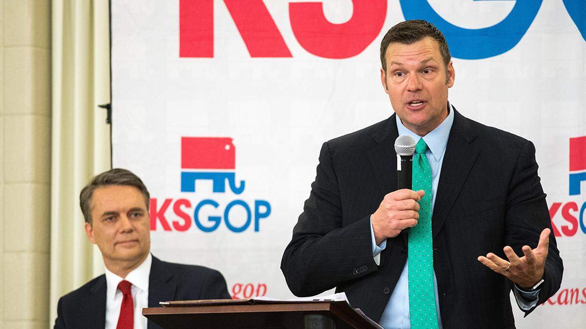 Kansas Secretary of State Kris Kobach, right, and Gov. Jeff Colyer.