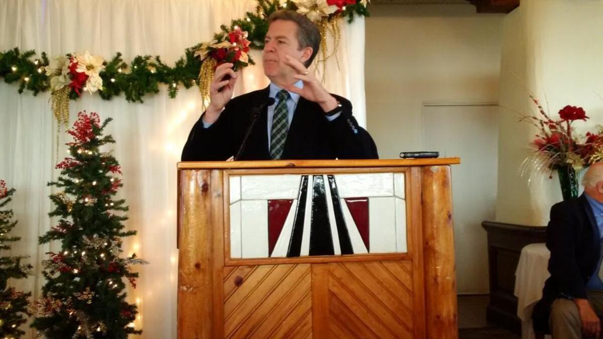 Awaiting confirmation as the nation’s ambassador for religious freedom, Kansas Gov. Sam Brownback gives a farewell address at the Wichita Pachyderm Club.