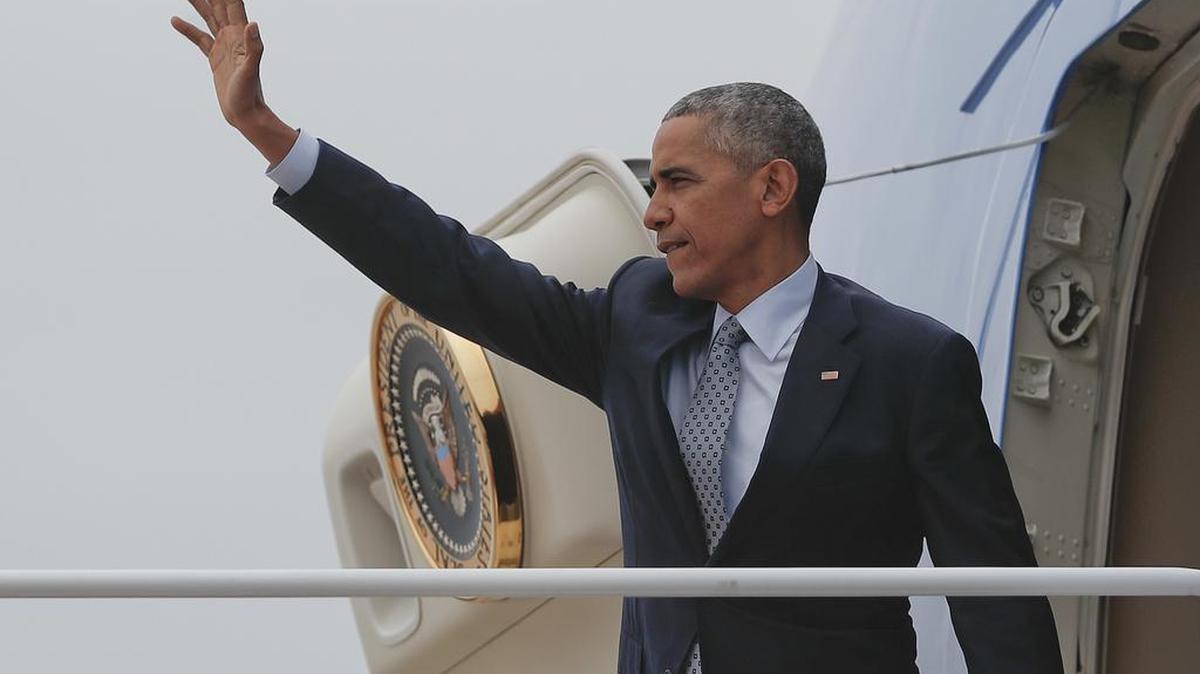 President Obama waves while boarding Air Force One at Andrews Air Force Base in Maryland on Tuesday. Obama is kicking off a week of campaigning for Democrat Hillary Clinton with a stop in battleground Ohio.