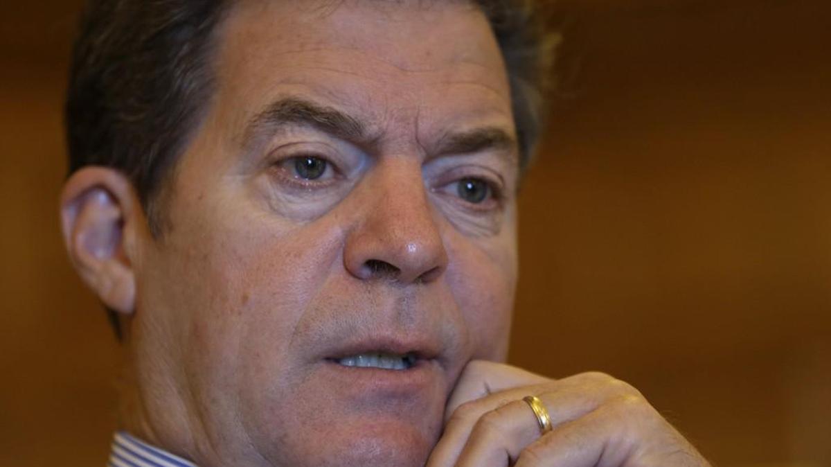 Gov. Sam Brownback responds to a reporter’s question in his Statehouse office in Topeka on Sept. 11, 2015.