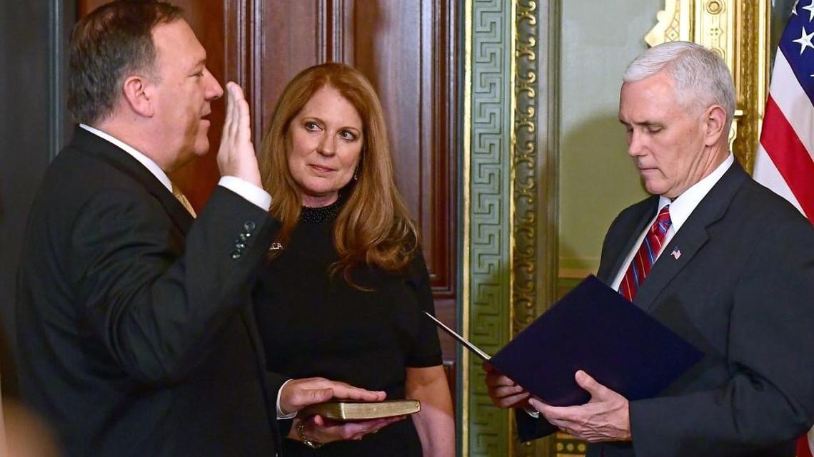 Rep. Mike Pompeo, left, is sworn in Monday night as director of the CIA by Vice President Mike Pence with Pompeo’s wife, Susan, in Washington, D.C. (Jan. 23, 2017)