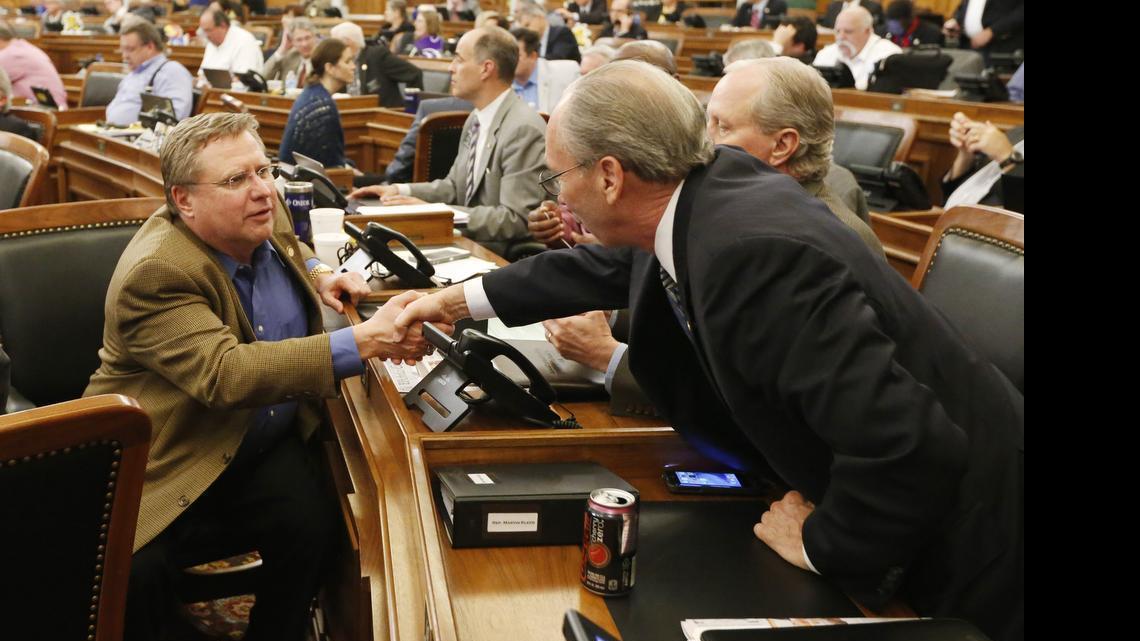 
Rep. Mark Hutton of Wichita, left, shakes hands with Kansas House Taxation Committee Chairman Marvin Kleeb after HB 2109 finally passed after 4 a.m. Friday. (June 12, 2015)
