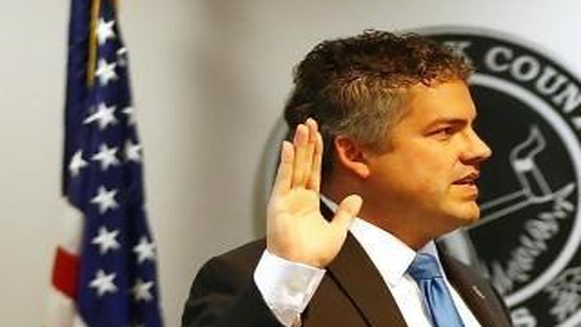 Kelly Arnold, left, takes the oath of office for Sedgwick County Clerk at the Sedgwick County Courthouse in January. Arnold won a third term as Republican state chairman at the party’s annual convention in Manhattan on Saturday.