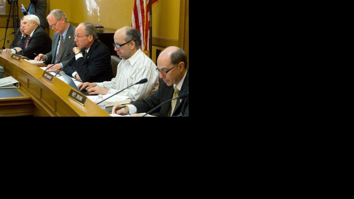 
Members of the House Taxation Committee listen Thursday to proponents and opponents of a bill that would increase the tax on a pack of cigarettes from the current 79 cents to $2.29. 
