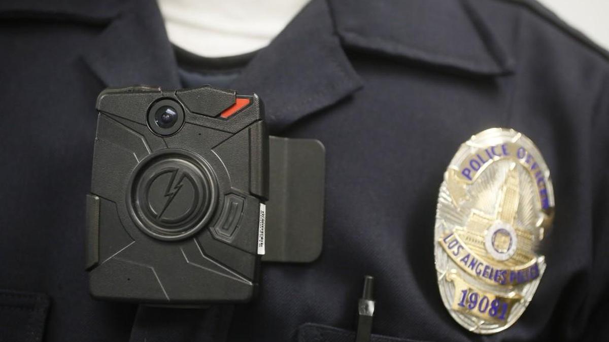 A Los Angeles police officer wears a Taser Axon on-body camera during a demonstration for media. (Jan. 15, 2014)
