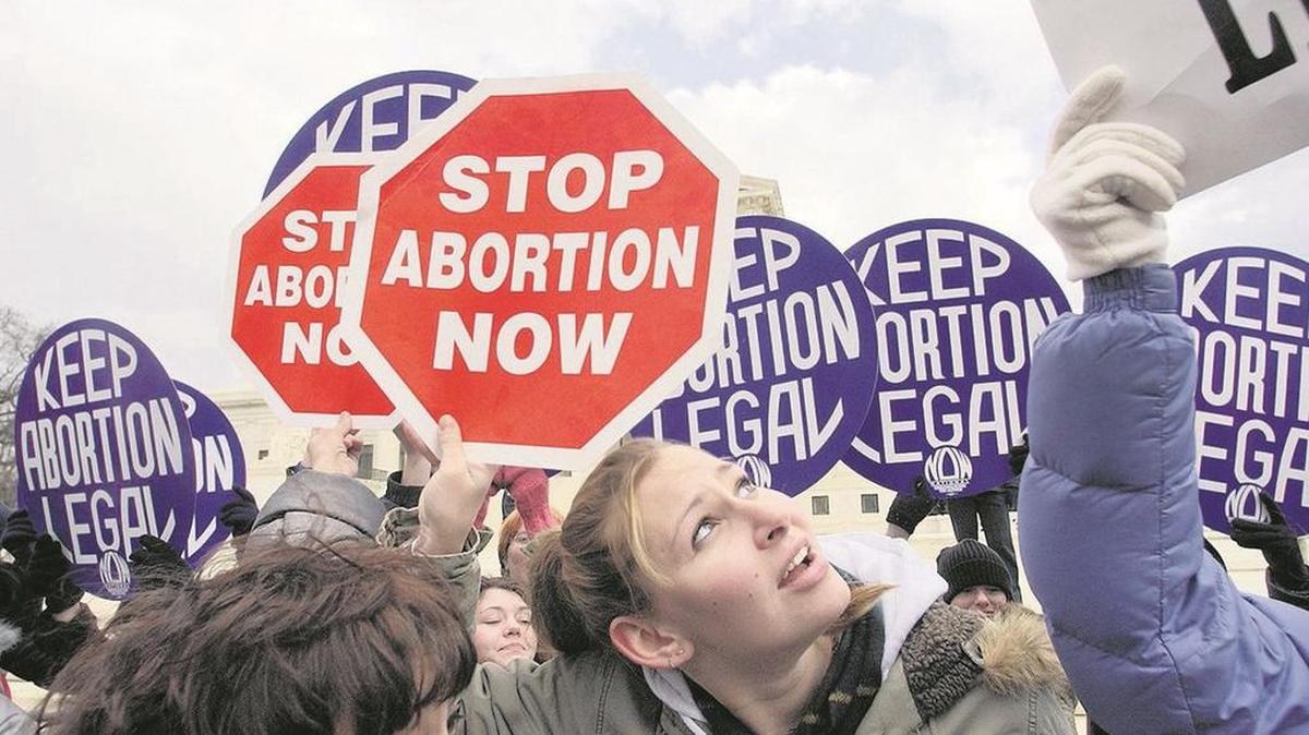 Protesters on both sides of the abortion issue take part in a demonstration.