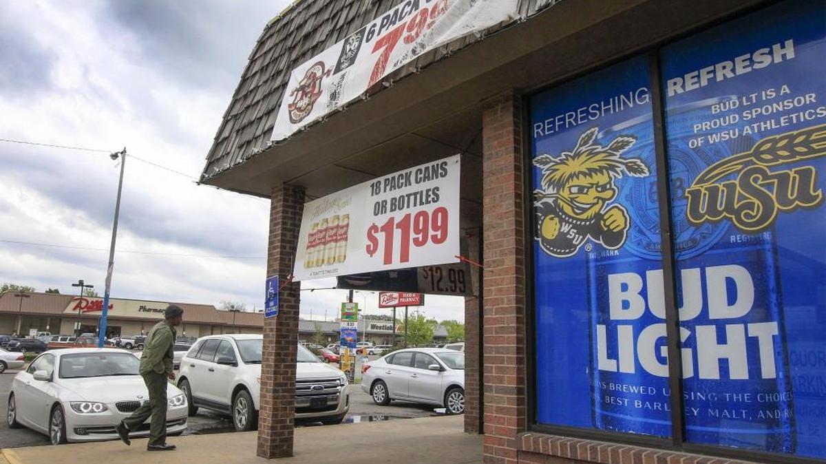 Customers shop at R&J Liquor near Douglas and Hillside just across the street from a Dillons. A new state law will allow grocery stores to sell stronger beer beginning in 2019. (April 21, 2017)