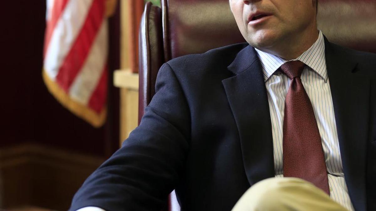 Kansas Secretary of State Kris Kobach talks with a reporter in his office in Topeka on Wednesday. Kobach has been picked by President Donald Trump to help lead a new commission on election fraud.