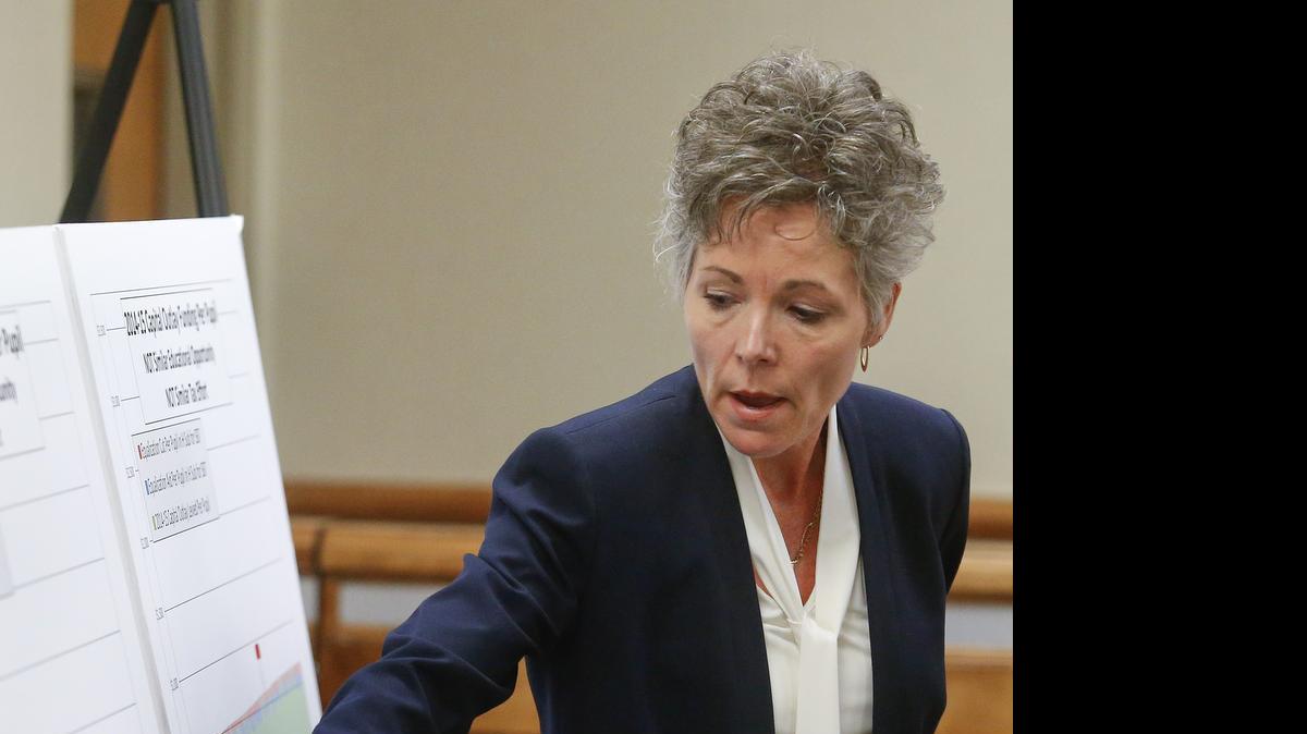 
Cythnia Lane, superintendent for USD 500 in Kansas City, Kan., shows her school district’s position on a graph depicting capital outlay funding per pupil during the Gannon et al. v. state of Kansas case on school finance hearing at the Shawnee County Courthouse in Topeka on Thursday, May 7, 2015. Lane testified in court Thursday that the state’s new school funding law is hurting her district’s efforts to educate its students. 
