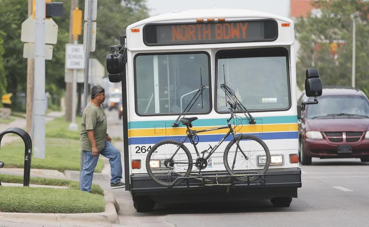 A passenger boards a city bus on north Broadway. (Aug. 22, 2013)