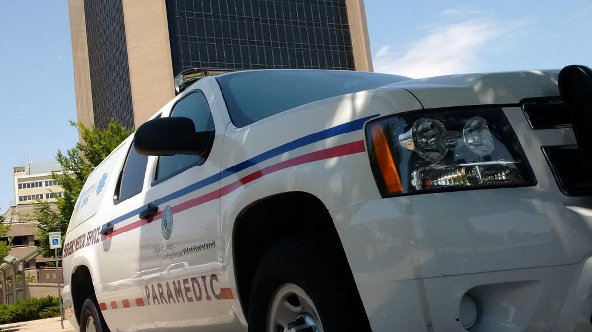 A Sedgwick County Emergency Medical Services paramedic vehicle sits outside Wichita City Hall on Wednesday, when the city and the county discussed their EMS contract at a rare joint meeting. (July 28, 2017)