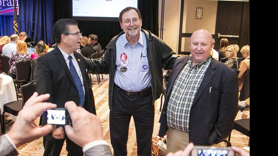 
From left, Jim Howell, Karl Peterjohn and Richard Ranzau pose for pictures at the Sedgwick County Republican Party election watch party in November. Howell’s election created a new majority on the Sedgwick County Commission. 

