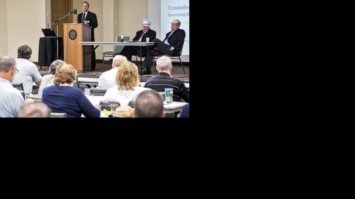 
Panelists Paul Allen, standing, Jeff Finkle and John Tomblin participate in the Kansas Policy Institute’s community forum on the proposed job development fund, part of the 1-cent-on-the-dollar sales tax that will be on the November ballot. (Sept. 19, 2014)
