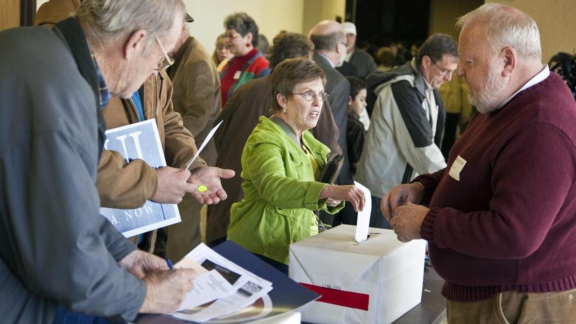 Republicans cast their ballots during the GOP presidential caucus at Century II in downtown Wichita in 2012. Democrats and Republicans will caucus on the same day this year, on Saturday.