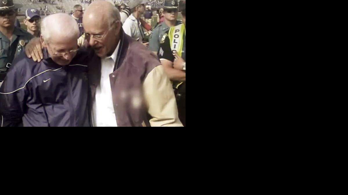 
In this image from his television ad provided by the Roberts campaign, Republican Kansas Sen. Pat Roberts, right, talks with Kansas State University football coach Bill Snyder. Roberts' campaign launched a statewide spot Thursday, Oct. 30, 2014 with Snyder endorsing the three-term incumbent just five days before the election, which has Roberts locked in a tough contest with independent candidate Greg Orman. (AP Photo/Pat Roberts Campaign) 
