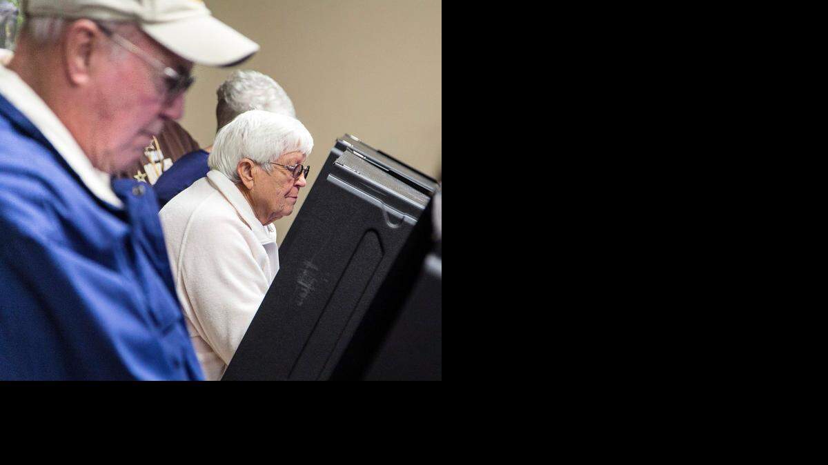 
Wayne Avery and and his wife, A.J., cast ballots during early voting Friday at the Sedgwick County Zoo. (Feb. 27, 2015)
