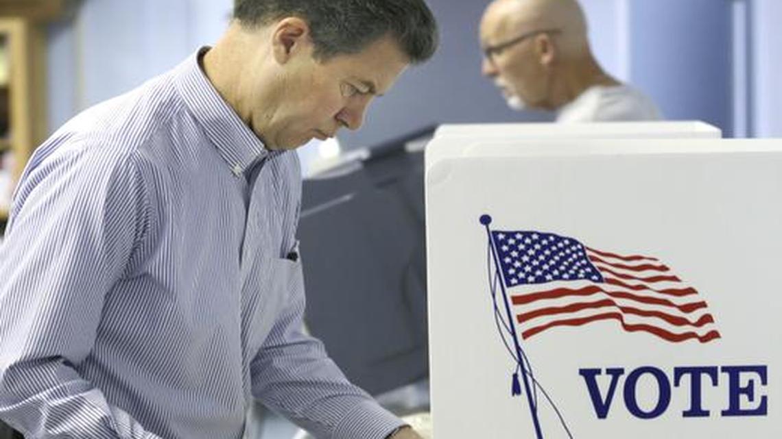 
Republican Gov. Sam Brownback votes in advance at the Shawnee County elections office in Topeka on Monday.
