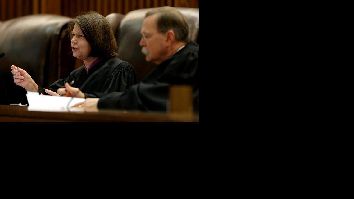 
Kansas Supreme Court Justice Marla J. Luckert asks questions during a hearing of a petition brought by former Democratic U.S. Senate candidate Chad Taylor against Kansas Secretary of State Kris Kobach seeking removal of Taylor's name from the ballot Tuesday, Sept. 16, 2014, in Topeka.
