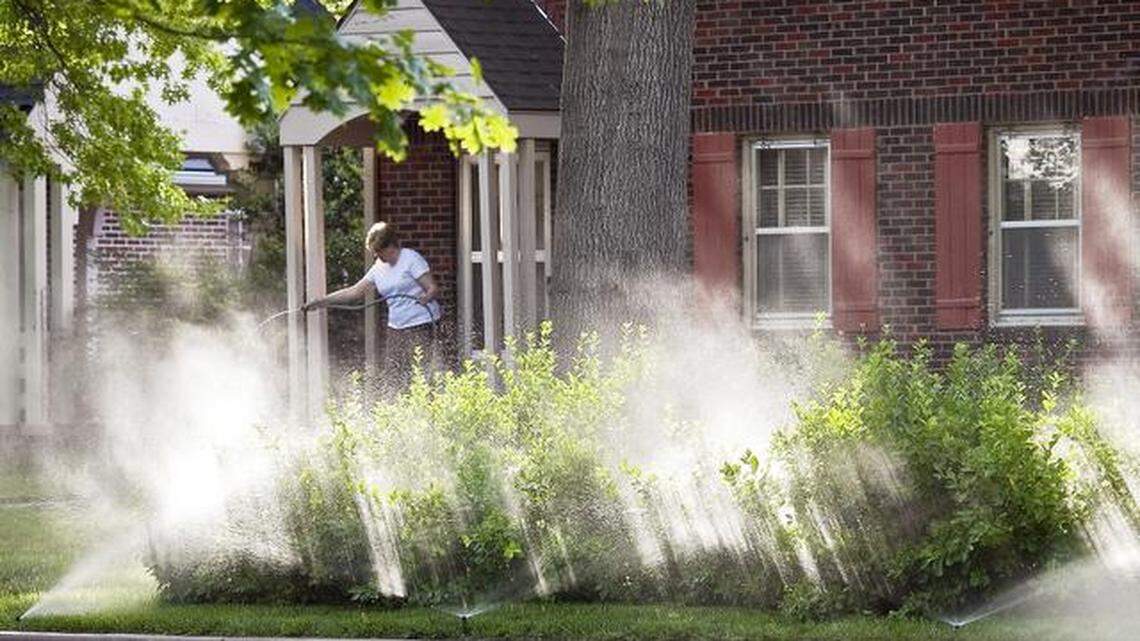 Sprinklers water a lawn in North Riverside. A portion of the proposed sales tax would go toward future water needs.